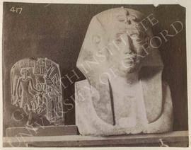 [Left] Small round-topped stela (plaque) showing the god Shed on its recto holding a lion and a g...