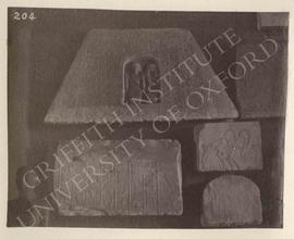 [Upper left] Pyramidion of Ptah...set with the deceased kneeling in a niche, Dyn. XVIII, provenan...