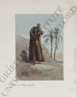 Upper Egypt, a portrait of a woman carrying a young child on her shoulder