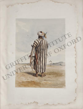Egypt, portrait of a Bedouin sheikh with a gun and a sword, back view