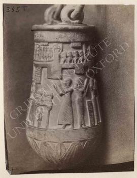 Situla with the deceased and his wife (no names) before divinities, etc., bronze, Ptolemaic Perio...