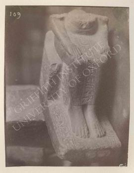 Lower part of the seated statue of Paka, black granite, temp. Amenophis III, provenance not known...