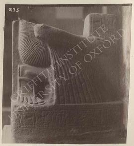 Headless kneeling statue of Amenmosi holding a naos of Hathor, probably temp. Ram. II, probably f...
