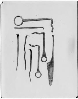 Copper implements, including a knife or razor, perhaps from a toilet set?